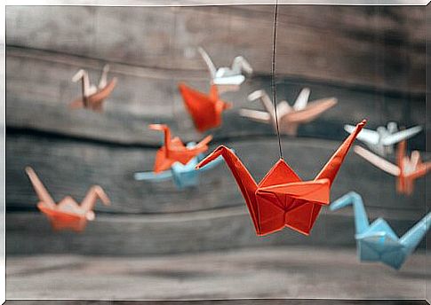 What do Origami cranes symbolize?